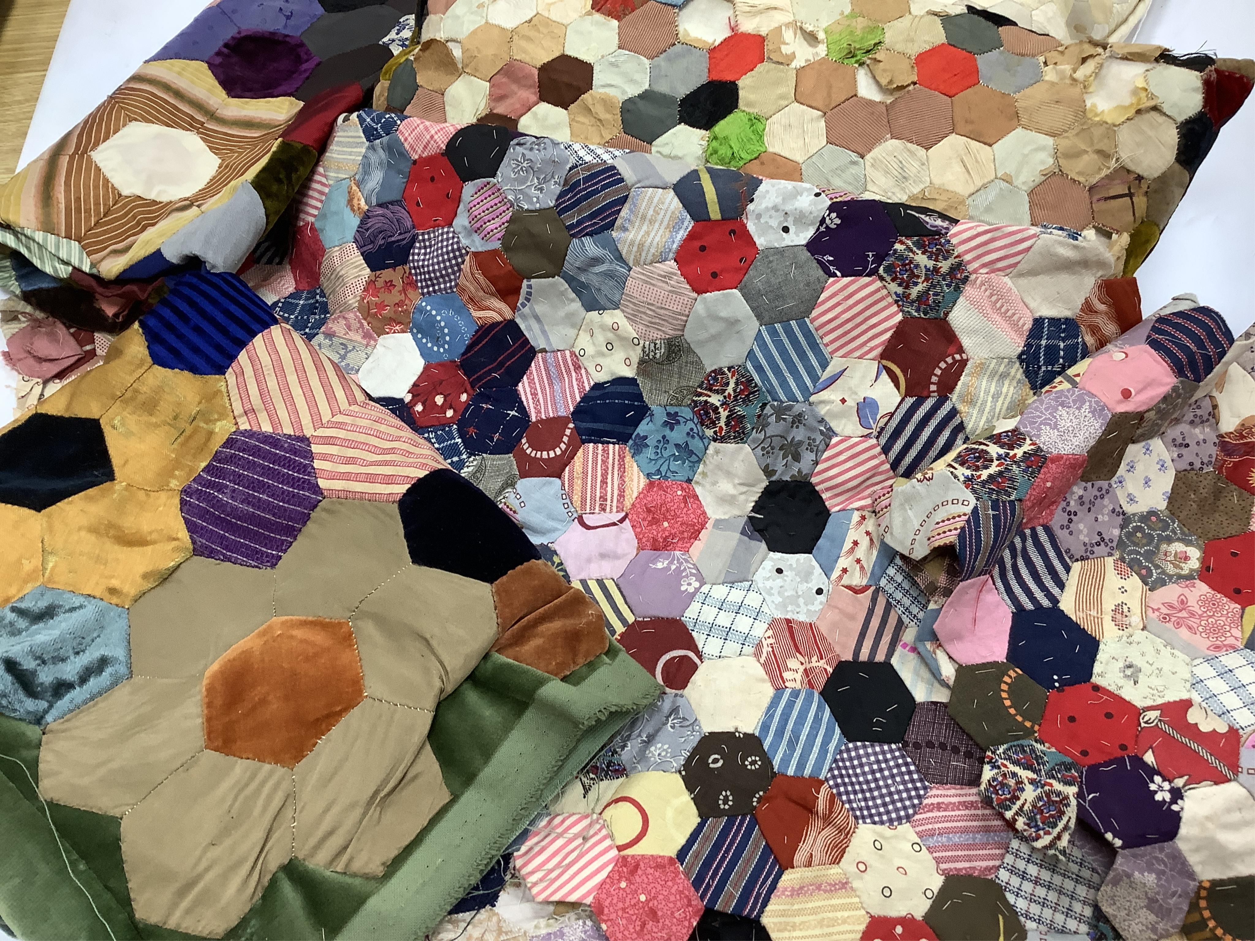 Three various sized 19th century patchwork panels and two patch worked cushions, for using as restoration fabric for larger damaged quilts.